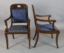 A pair of 19th century French Empire style ebony strung mahogany elbow chairs, with padded backs and