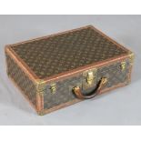 A Louis Vuitton suitcase, with brass mounted LV fabric, no.957179, 20 x 14.5 x 7in.