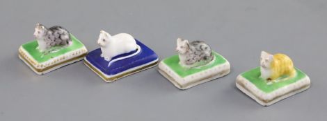 Four Chamberlain Worcester miniature porcelain figures of recumbent kittens, c.1820-40, each on a