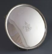 A George III silver circular salver, by Elizabeth Jones, with beaded border and centre with engraved