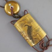 A Japanese four case gold lacquered inro, Meiji period, decorated with a hawk on a pine tree, the