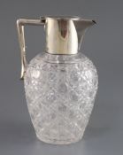 An Edwardian silver mounted cut glass claret jug, John Grinsell & Sons, with angular handle, London,