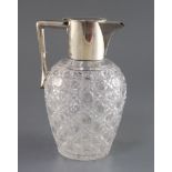 An Edwardian silver mounted cut glass claret jug, John Grinsell & Sons, with angular handle, London,