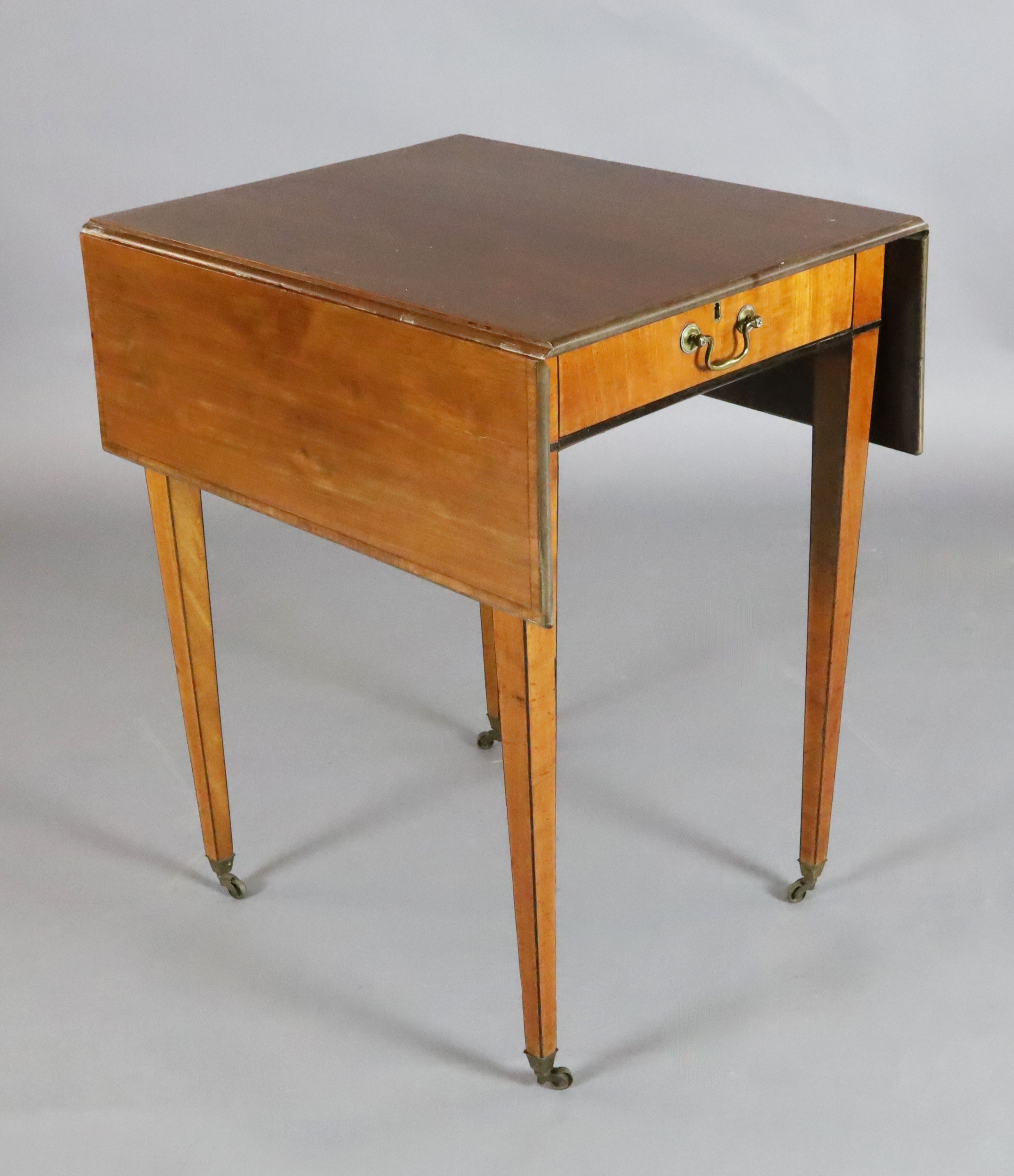 A George III ebony banded satinwood Pembroke table, with frieze drawer and rectangular flaps, on