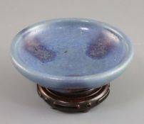A Chinese Jun type purple-splashed dish, Qing dynasty, unglazed dark brown disc foot, D. 12.5cm,