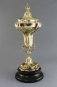 A George V silver gilt trumpet shaped trophy cup and cover, by Goldsmiths & Silversmiths Co Ltd, the