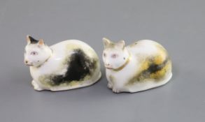 Two Derby porcelain figures of recumbent cats, c.1830, each with tortoiseshell markings, incised '