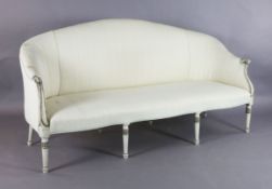 A George III parcel gilt white painted settee, with striped upholstery, W.6ft 2in. D.2ft