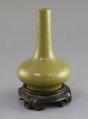 A Chinese teadust glazed bottle vase, 18th/19th century, H. 15cm, wood standProvenance - Mr Keel,