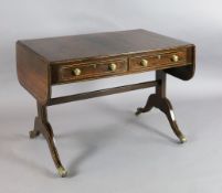 A Regency boxwood strung rosewood sofa table, with two frieze drawers, on end standards with