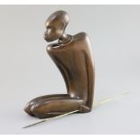 A Hagenauer hardwood figure of a kneeling native man holding a brass spear, stamped marks to base,