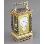 An early 20th century French ormolu and champleve enamel hour repeating carriage alarum clock,