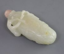 A Chinese white jade snuff bottle, 19th century, in the form of a gourd carved in relief with