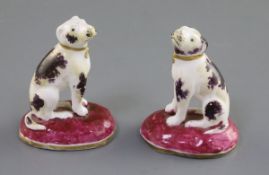 A pair of Rockingham porcelain figures of pointers, c.1830, each with dark puce and cream