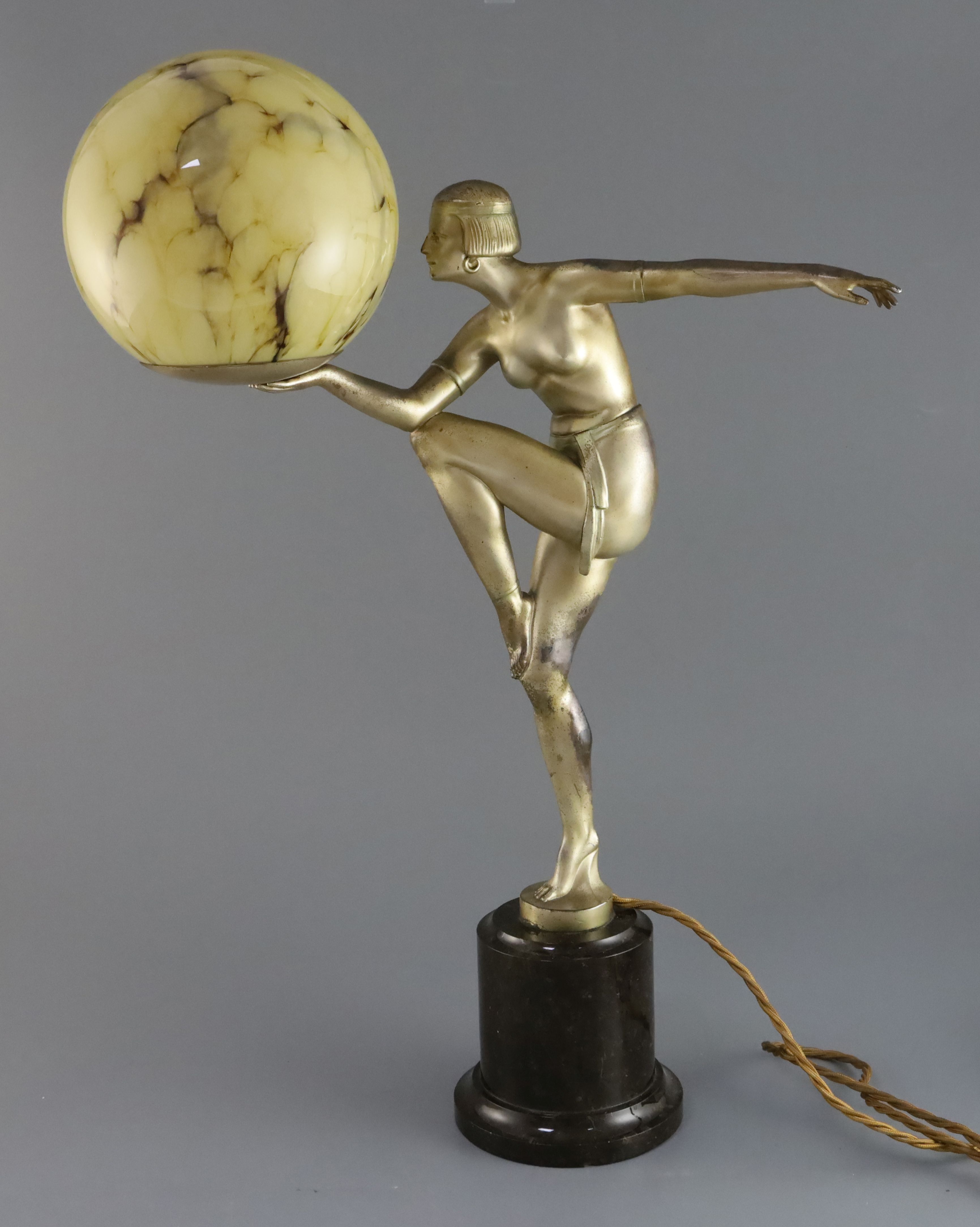 After Maurice Guiraud-Rivière (French 1881-1947). A silvered spelter table lamp, modelled as a