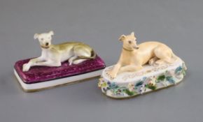 Two Minton porcelain figures of recumbent greyhounds, c.1831-40, the first on a stippled crimson