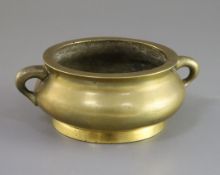 A Chinese bronze gui censer, Xuande mark, 18th/19th century, of compressed baluster form applied
