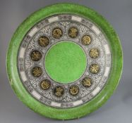 Piero Fornasetti (1913-1988). A large circular tray 'Bordo Strumenti Musicali', c.1960, 23in.