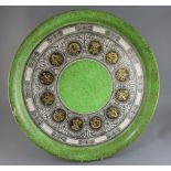 Piero Fornasetti (1913-1988). A large circular tray 'Bordo Strumenti Musicali', c.1960, 23in.