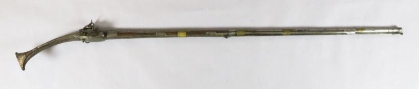 A Persian flintlock musket, with acorn trigger and engraved steel mounts, barrel stamped Comino,