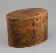 A George III satinwood and marquetry tea caddy, of oval form, decorated with floral sprays with