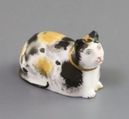 A rare Copeland & Garrett porcelain figure of a recumbent cat, c.1833-47, with tortoiseshell