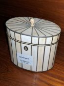 A Regency ivory veneered tea caddy, of oval from with pewter stringing, height 4.7in.