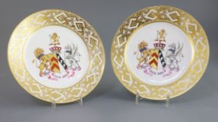 A pair of Chamberlains Worcester armorial plates, painted with the arms to commemorate the