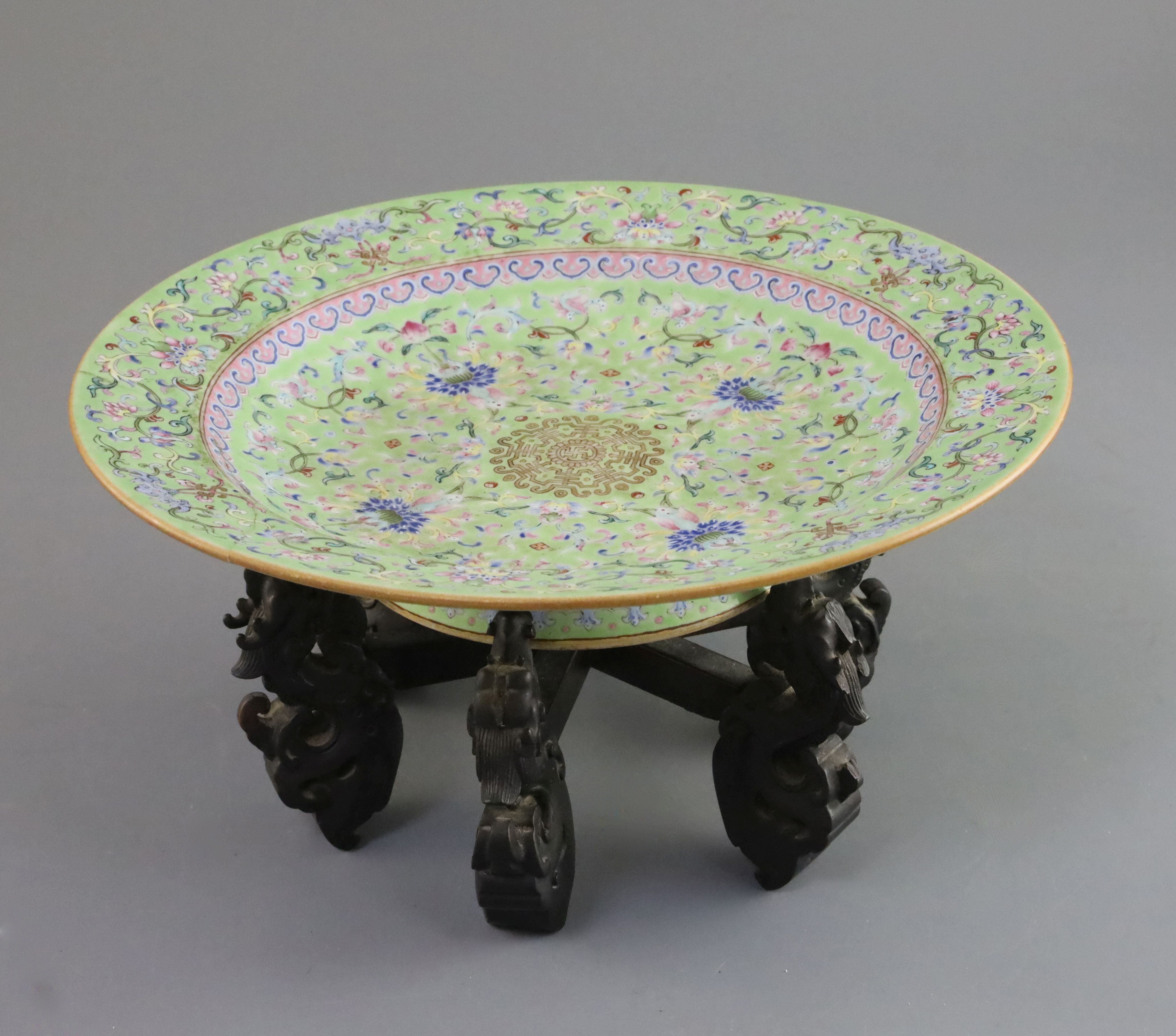 A Chinese lime green ground footed dish, Daoguang seal mark and of the period (1821-1850), finely