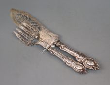 A pair of Victorian engraved silver fish servers, Birmingham, 1850.