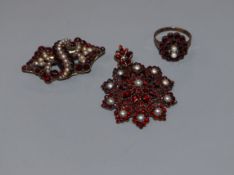 Two Victorian garnet set brooches and a similar ring.