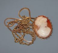 A modern 9ct. gold framed carved cameo portrait brooch, a 9ct. gold multi-twist necklace and one