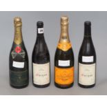 A bottle of Moet Chandon 1985, a bottle of Veuve Cliquot and four bottles of Morgan, 2000