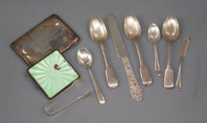 A silver and enamel compact (a.f.), a silver cigarette case and eight items of silver flatware.