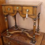 A 17th century style walnut lowboy W.72cm