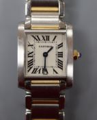 A lady's Cartier steel and yellow metal Tank Francaise quartz wrist watch, no box or paperwork.