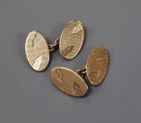 A pair of 9ct. gold oval disc cufflinks, 7 grams.