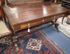 A Regency mahogany and marquetry inlaid library table having gilt brass and ormolu mounts, on turned