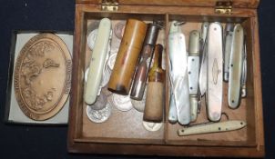 A Sorrento box containing assorted pocket knives and sundries