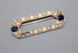 An early 20th century French 18ct white metal, sapphire, split pearl and split coral set octagonal