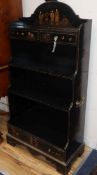 A chinoiserie black-laquered 'waterfall' bookcase H.120cm