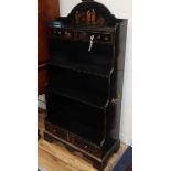 A chinoiserie black-laquered 'waterfall' bookcase H.120cm