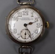 An early 20th century 800 white metal Longines trench style manual wind wrist watch, retailed by