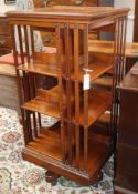A Harrods walnut revolving bookcase with ratchet top H.110cm