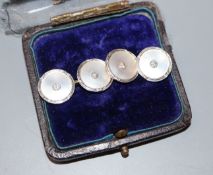 A pair of early to mid 20th century 18ct and plat, mother of pearl and diamond set cufflinks.