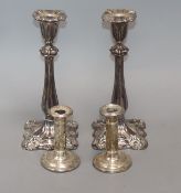 A pair of plated candlesticks and one pair of small silver candlesticks tallest 26cm