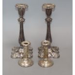 A pair of plated candlesticks and one pair of small silver candlesticks tallest 26cm