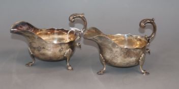 A pair of late Victorian silver sauceboats, with flying scroll handles, Sheffield 1895, 12.5 oz.