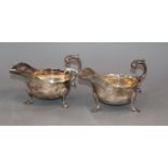 A pair of late Victorian silver sauceboats, with flying scroll handles, Sheffield 1895, 12.5 oz.