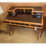 A faux ebony and bamboo desk W.104cm